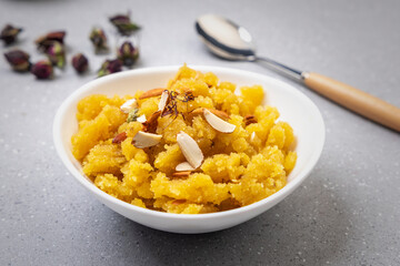 Moong Dal Halwa or Mung Daal Halva is an Indian dessert recipe, made with mung lentil, clarified butter and sugar, garnished with dry fruits