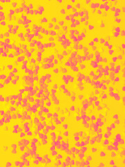 Hearts candies on yellow background.