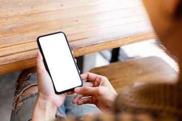 cell phone blank white screen mockup.woman hand holding texting using mobile on desk at office.background empty space for advertise.work people contact marketing business,technology