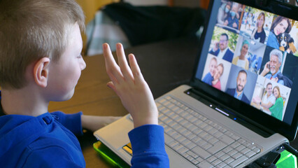young boy is happy to greeting his parents on video call