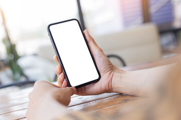 cell phone blank white screen mockup.woman hand holding texting using mobile on desk at office.background empty space for advertise.work people contact marketing business,technology