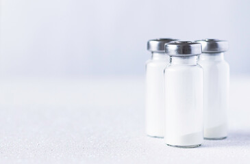 Medical glass vials for injection on a white background. Medicines and treatment of diseases,...