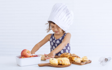 A little girl is making bakery