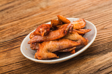 A plate of freshly baked chicken wings，Chicken Wing Tip