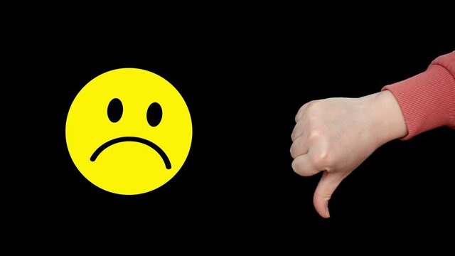 Yellow unhappy dissatisfied smile face and thumbs down showing negative opinion on black background. Yellow sad smile and thumbs down with negative emotion icon