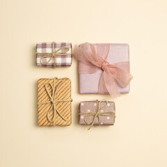 Gift boxes on beige background. flat lay, top view, copy space