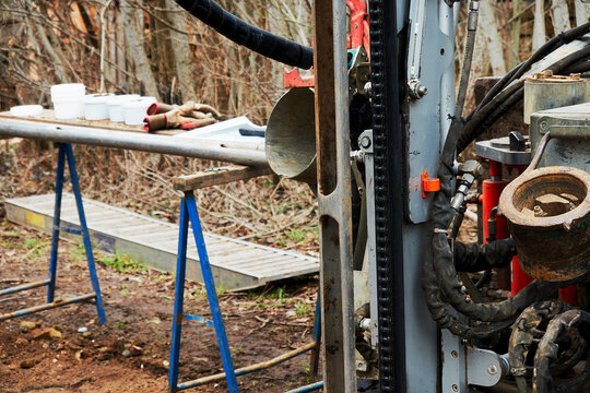 Drill Rig And Soil Probe For Taking Soil Samples In Front Of A Field Table For Sampling