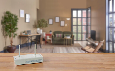 Modem and router box on the table and living room background blur concept.