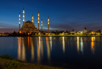 Fototapeta na wymiar Blue hour long exposure and reflection view, Sabanci Central Mosque, Resatbey, Seyhan, Adana, Turkey