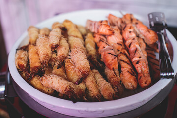 Catering table, beautifully decorated banquet with variety of with different food snacks and appetizers on corporate birthday party event or wedding celebration, seafood, canape, delicatessen setting