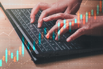 Business analytics and trading concept. Businesswoman hands using laptop analyzing stock graph chart forex charts. Plans to increase business growth.