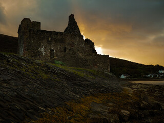 A dilapidated castle one of many in Scotland shot as the sun sets on the coastline