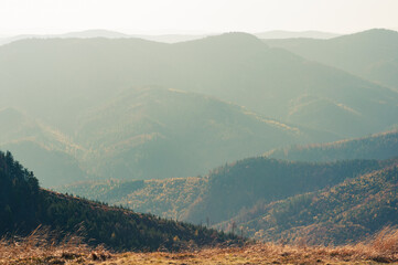 View from high mountain on picturesque landscape autumn Carpathian mountains.
