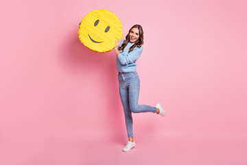 Full length body size view of attractive cheerful girl holding smiley having fun isolated over pink pastel color background