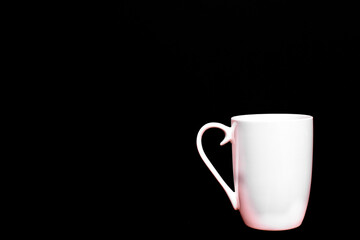 White cup of coffee, empty and blank, isolated on black background with copy space.