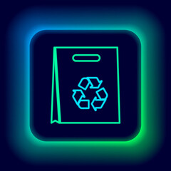 Glowing neon line Paper shopping bag with recycle icon isolated on black background. Bag with recycling symbol. Colorful outline concept. Vector