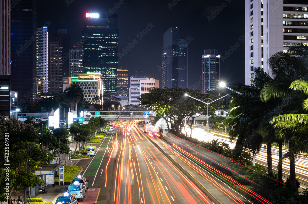 Wall mural Traffic light trails in the modern business district in Jakarta, Indonesia capital city