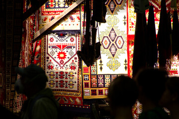 Close-up of traditional romanian carpets bathed in sunlight