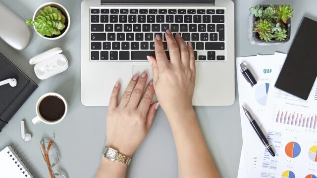 Woman hands typing on laptop top view Stopmotion
