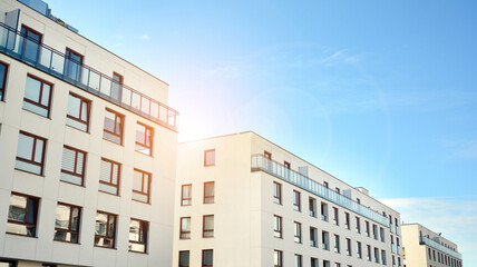 Fototapeta premium Part of city real estate property and condo architecture. Detail in modern residential flat apartment building exterior. Fragment of New luxury house and home complex. 