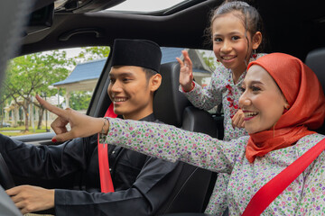 Family inside the car driving to celebrate eid