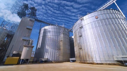 Large Grain Bins. Modern Granary elevator. Agribusiness.