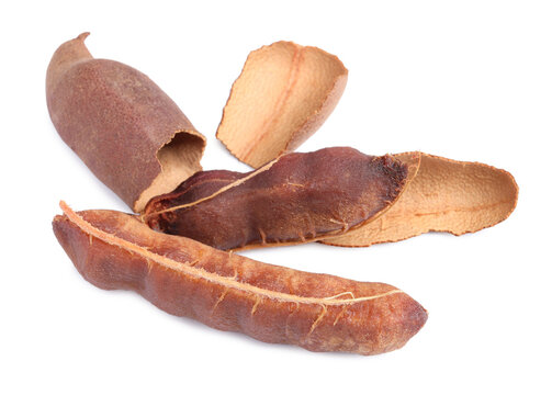 Delicious ripe tamarinds on white background. Exotic fruit