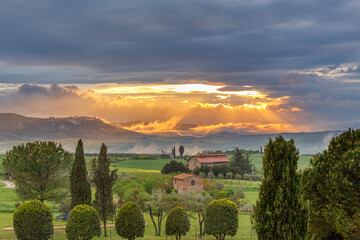 Valley in Tuscany with sunset in the mountains