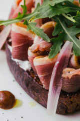 Delicious dinner on a white plate. Juicy portions of grilled fillet steak served with tomatoes and roast vegetables