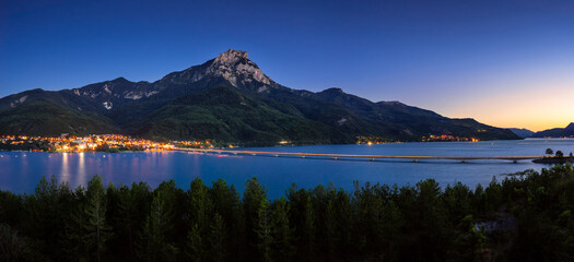 The village of Savines-le-Lac and Serre-Poncon Lake in summer with Grand Morgon Peak at twilight....