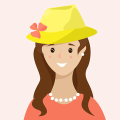 A smiling girl in a yellow hat