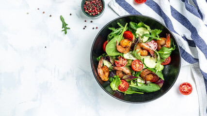 Dietary menu. Healthy vegan salad of smoked shrimps, cherry tomatoes, cucumber and mixed leaves. Healthy eating concept. Detox diet. Vegetarian lunch. Weight loss, top view