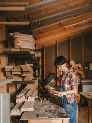 Girl woodworker in a country
