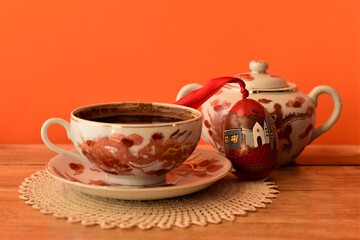 cup of tea and teapot with easter egg
