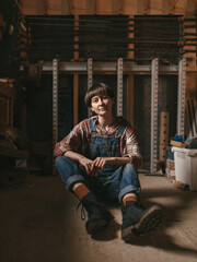 Fototapeta na wymiar Girl woodworker in a country 