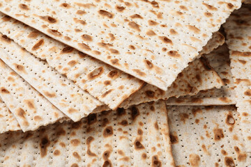 Traditional matzos as background, closeup. Pesach celebration