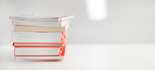 Colored books on a white background with a place for an inscription. Composition of books for reading. self-development books.