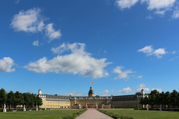 Fototapeta na wymiar Bright blue and white cloudscape over Karlsruhe Palace in the middle of the city (Baden, Germany)