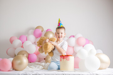 Little boy with Cake . Small child with party balloons, celebration. Birthday, happiness, childhood, look.