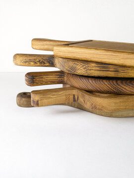 Stack of cutting boards for the kitchen on white background.