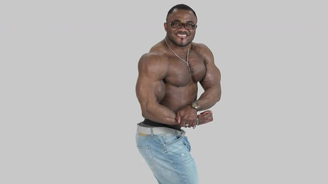 African male model posing shirtless. African male bodybuilder doing bodybuilding pose