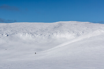 Fototapeta na wymiar Snow covered mountain with sunlight and shadows.Shot in Sweden, Scandinavia