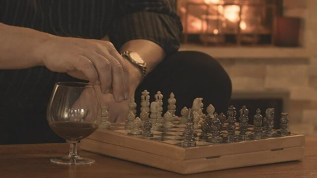 Game of Chess. Close Up of Hand Confident Businessman moving a white pawn