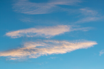 Naklejka na ściany i meble Cloud formation in warm colors at dusk. Shot in Sweden, Scandinavia.