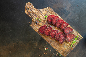 Dry beef veal sausage mahan dry-cured horse meat snack healthy meal top view copy space for text...