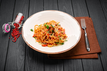 spaghetti dinner with meat sauce and basil