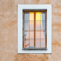 Romanesque style architecture facade with window and interior atmosphere light, Prague city, Czech Republic.