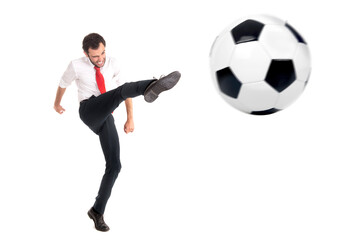 Fototapeta na wymiar Businessman kicking a football