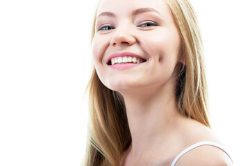 Happy young attractive blond woman with beautiful smile and healthy teeth, over white background. Dental health, whitening, prosthetics and care