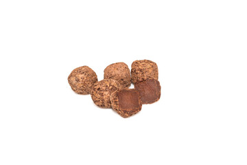 Handmade chocolate truffles closeup isolated on white.